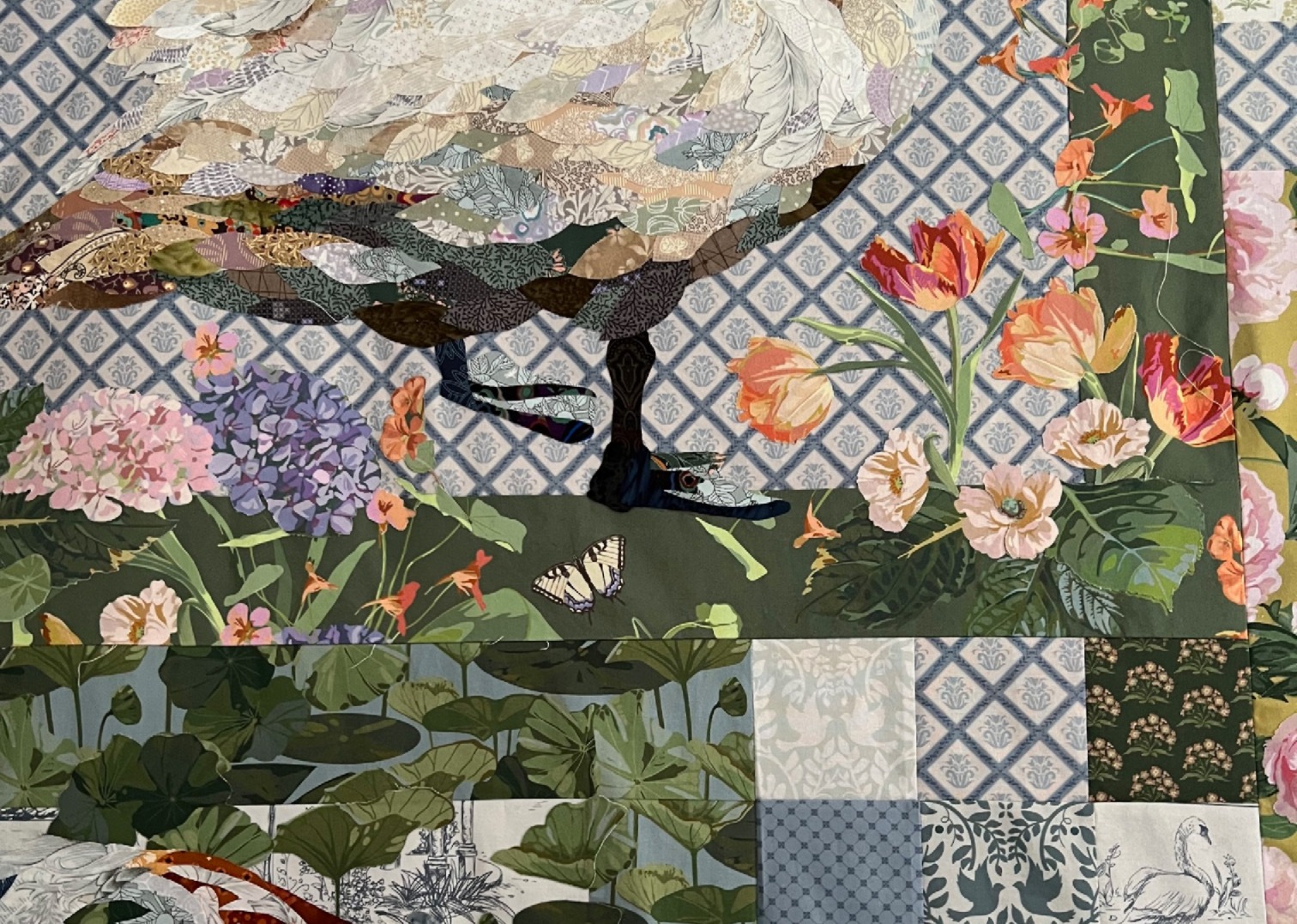 close up of a collage quilt with animals