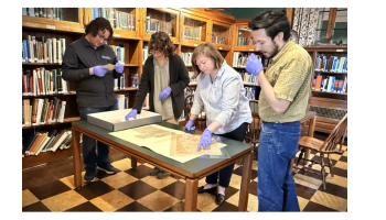 Story Center staff examining documents
